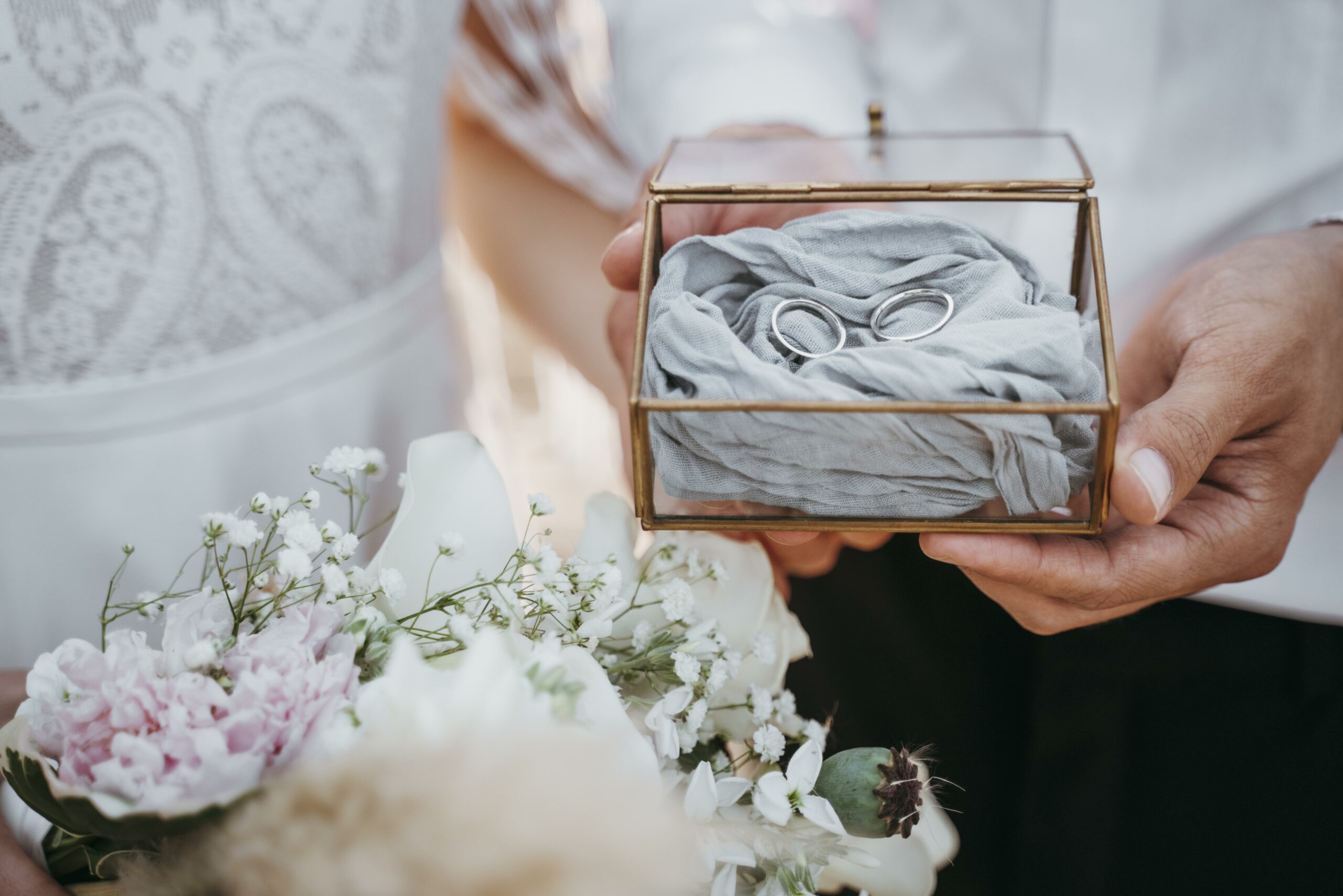 bride-groom-holding-their-rings
